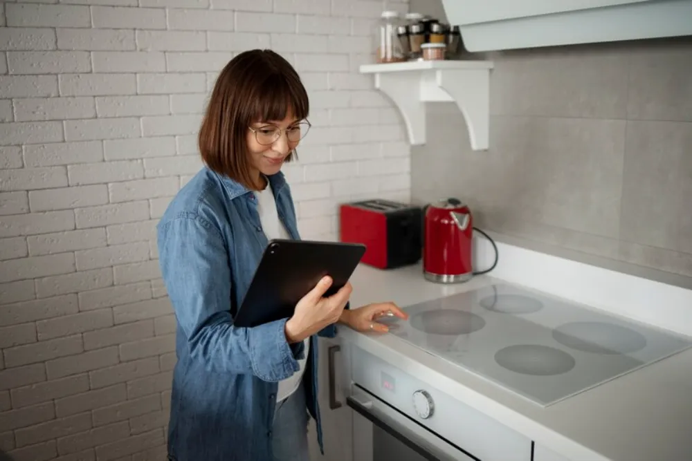 A woman checking Kenmore electric stove