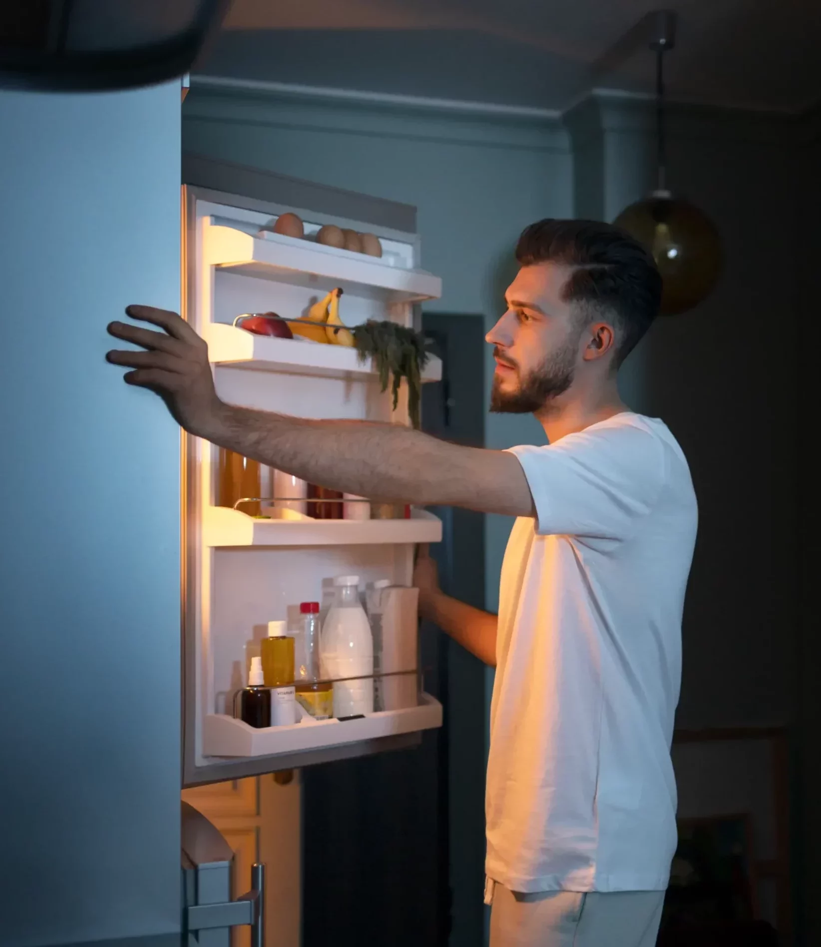 Man opening the door of a freezer